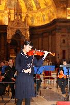 Quake's 3rd anniversary concert at Rome cathedral