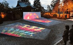 Kaleidoscope images projected on rock garden at Kyoto temple