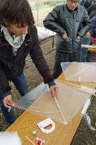 Afghan man makes traditional kite at Tokyo event