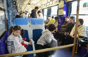 Tourists ride shinkansen look-alike train