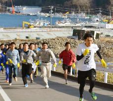 Tsunami-hit town's uphill race as evacuation reminder