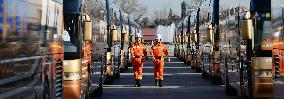 Firefighters patrol parking lot at Tiananmen Square