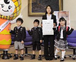 Ski jump star Takanashi donates schoolbags to children