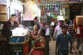 Vendor sells LED lamps in Old Delhi market