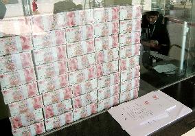 Money stacked up at China bank