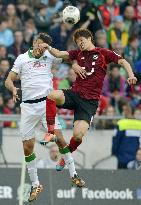 Hannover's Sakai heads ball in match against Bremen