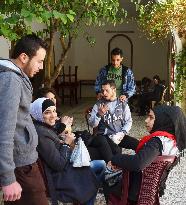 Vocational trainees in Syria chat during break