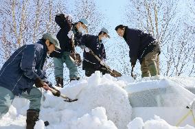 Hokkaido brewers unearth sake aged under snow