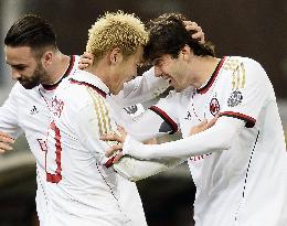 Milan's Honda celebrates his goal with Kaka