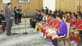 PM Abe greets young ASEAN, East Timor footballers