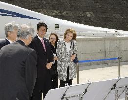 Abe inspects maglev train test line with Kennedy