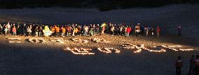 Disabled children write message with candles in Tottori, Japan