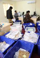 Afghan presidential election board officials tally ballots