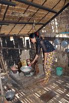 Woman cooks in her kitchen in Cambodia