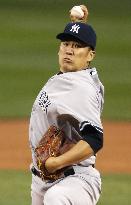 Tanaka earns 3rd win