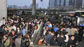 Beijing bus station crowed with commuters