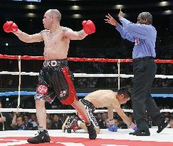 Spain's Martinez beats Japan's Hasegawa by TKO