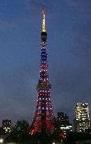 Skytree lit up by colors in red, white, blue
