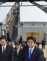Abe inspects temporary housing in Iwate village