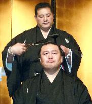 Sumo stablemaster cuts retired wrestler's topknot