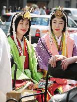 Women wear ancient court robes in Kyoto shrine parade