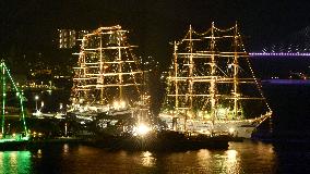 Tall ships brightly lit up at Nagasaki port festival