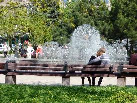 Ukrainian citizens in conflict-ridden Donetsk relax at park