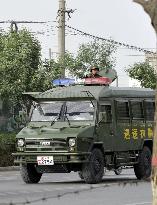 Armored car patrols in Xayar in Xinjiang Uyghur region