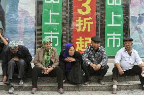 Local residents in Aksu in Xinjiang Uyghur region