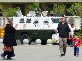 Chinese armored car on guard in central part of Urumqi