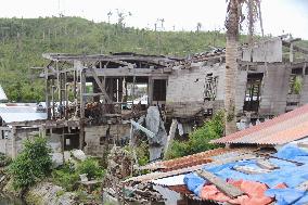 Typhoon-damaged homes deserted on Philippine island