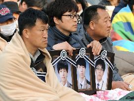 Relatives of sunken ferry victims