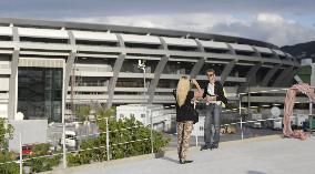 Couple takes picture before Rio World Cup stadium