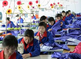 Workers at clothing factory in N. Korean economic zone