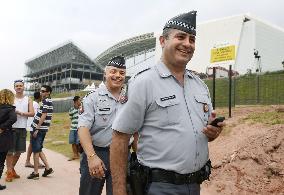 Policemen patrol around Arena de Sao Paulo