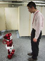 Hitachi robot holds conversation with man