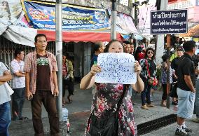 Woman protests against military coup in Thailand