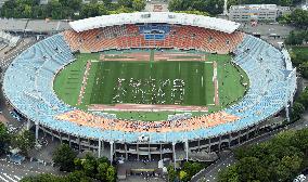 'Tokyo 2020' logo formed by people at National Stadium