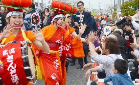 Dancer gives high-five at Tohoku Rokkon Festival