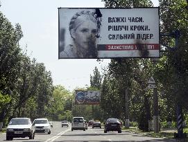 Damaged Tymoshenko billboard in Donetsk