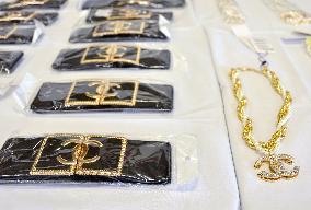 Police confiscate fake Chanel belts, necklaces