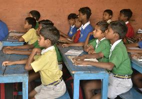 Indian 1st graders from lowest caste study at school