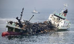 Explosion-hit tanker floats in wreckage in western Japan