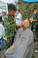 Thai soldiers give local people various aide