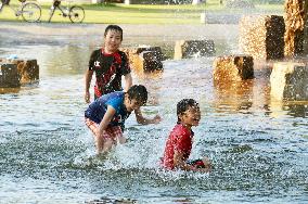 Kids play in water amid record heat in Hokkaido town