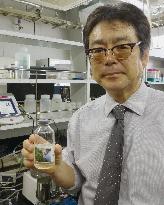Professor shows enzyme-producing bacteria
