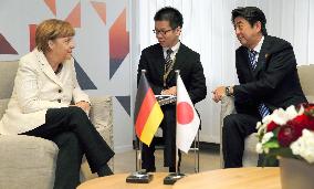 Japan, German leaders meet in Brussels