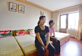 N. Korean female workers relax in new dormitory room