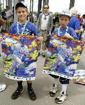 Boys hold Royals outfielder Aoki's posters