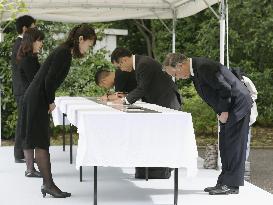 Mourners sign condolence book for deceased Prince Katsura